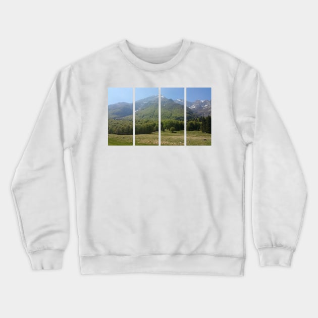 A static shot from the surroundings of Castaldia di Piancavallo with alps in background and a little mist. Beautiful nature in a spring sunny day; no people around Crewneck Sweatshirt by fabbroni-art